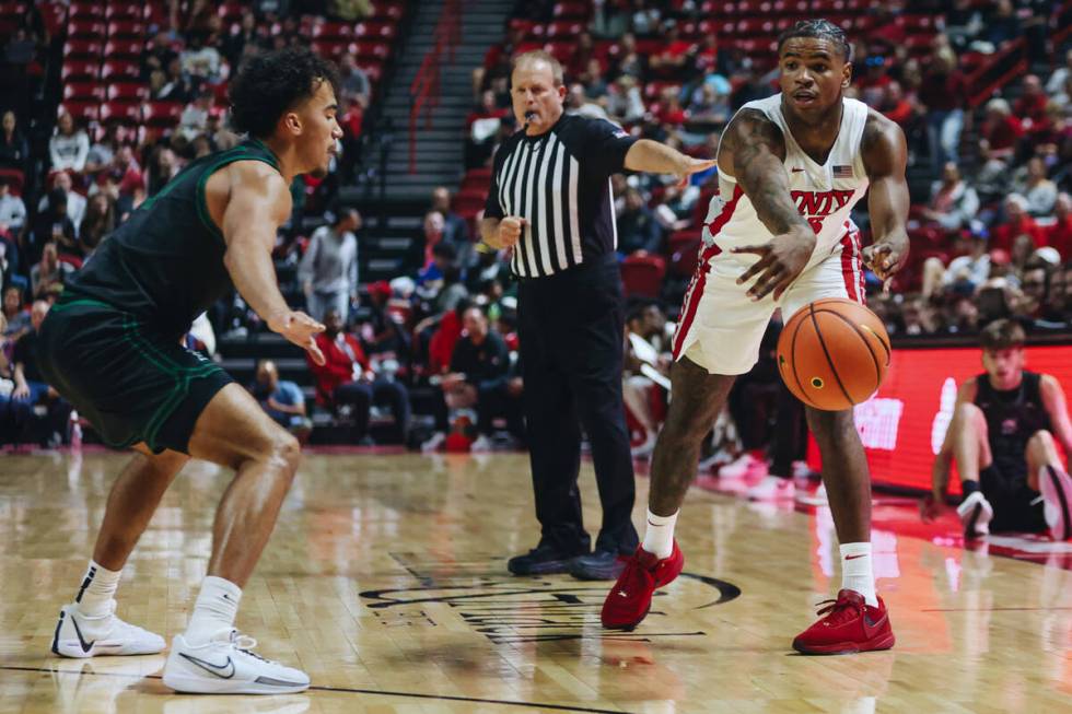 UNLV guard Luis Rodriguez (15) tosses the ball during a game against Stetson at Thomas & Ma ...