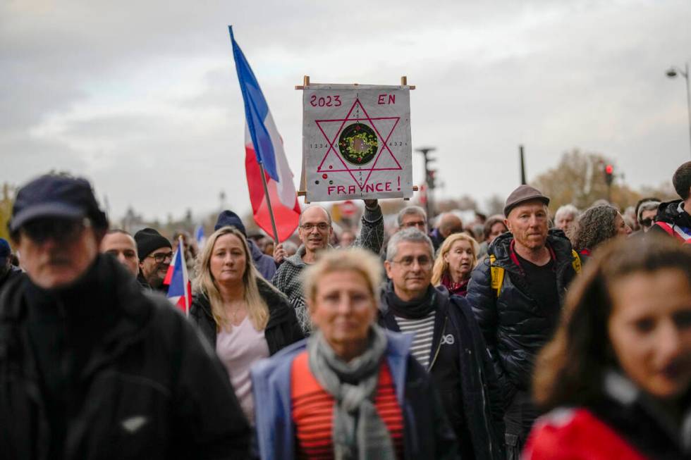 Thousands gather for a march against antisemitism in Paris, France, Sunday, Nov. 12, 2023. Fren ...