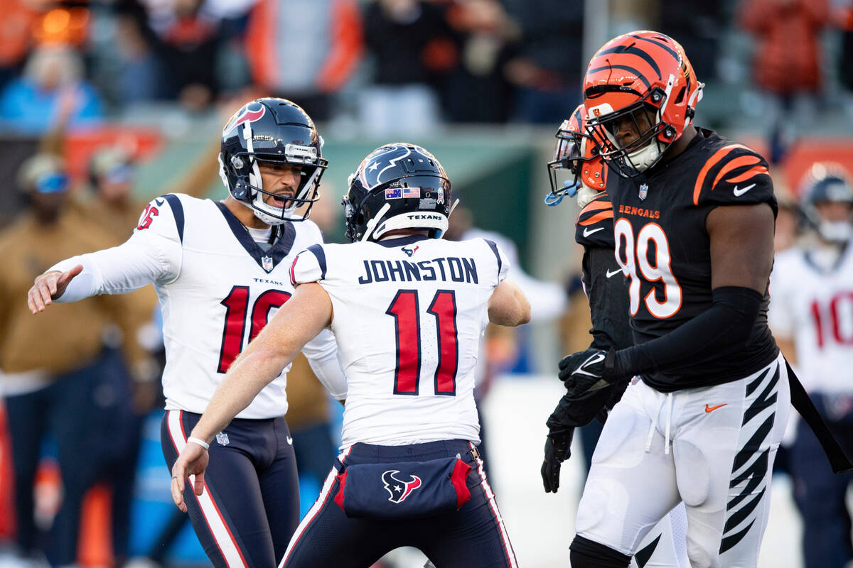 Houston Texans kicker Matt Ammendola (16) celebrates with punter Cameron Johnston (11) after ki ...