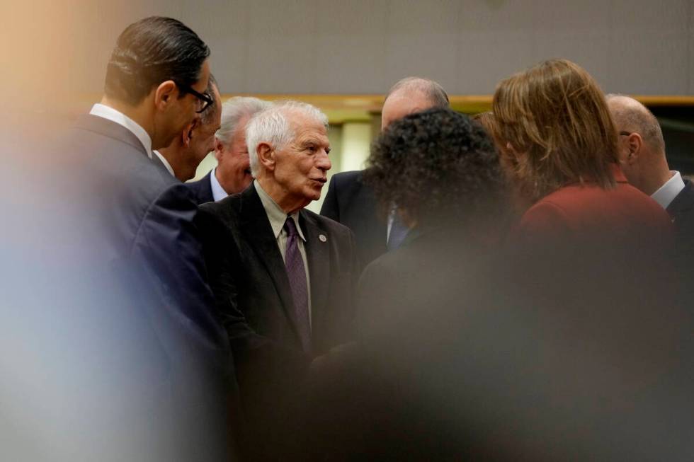 European Union foreign policy chief Josep Borrell, third left, speaks with from left, Cypriot F ...