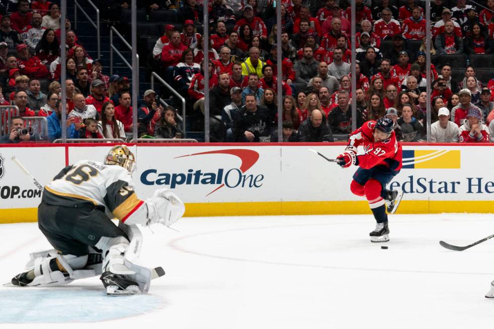 Washington Capitals center Evgeny Kuznetsov takes a shot against Vegas Golden Knights goaltende ...