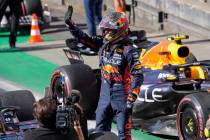 Red Bull driver Max Verstappen of the Netherlands waves after his first place sprint finish, a ...