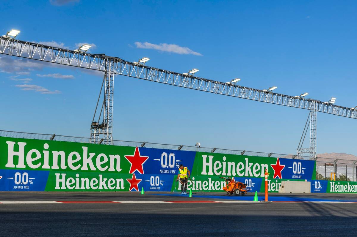 Turn one is painted with a logo about the Formula One Las Vegas Grand Prix pit building during ...