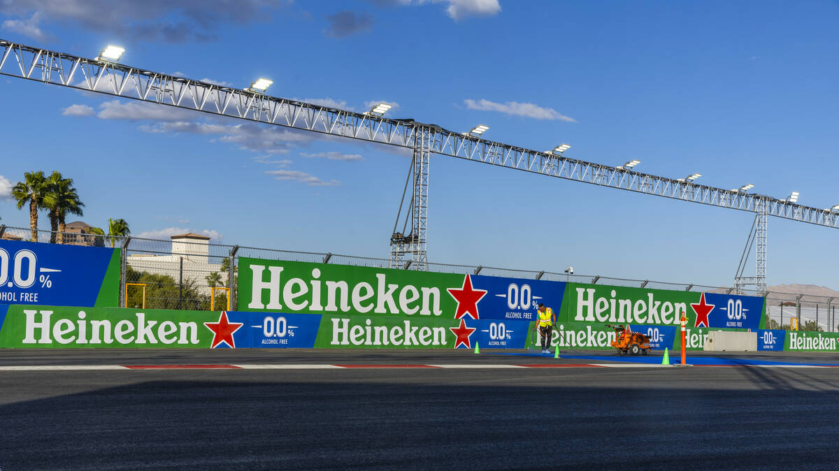 Turn one is painted with a logo about the Formula One Las Vegas Grand Prix pit building on Tues ...