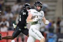 Air Force running back Dylan Carson (20) runs in for a touchdown against Hawaii during the seco ...