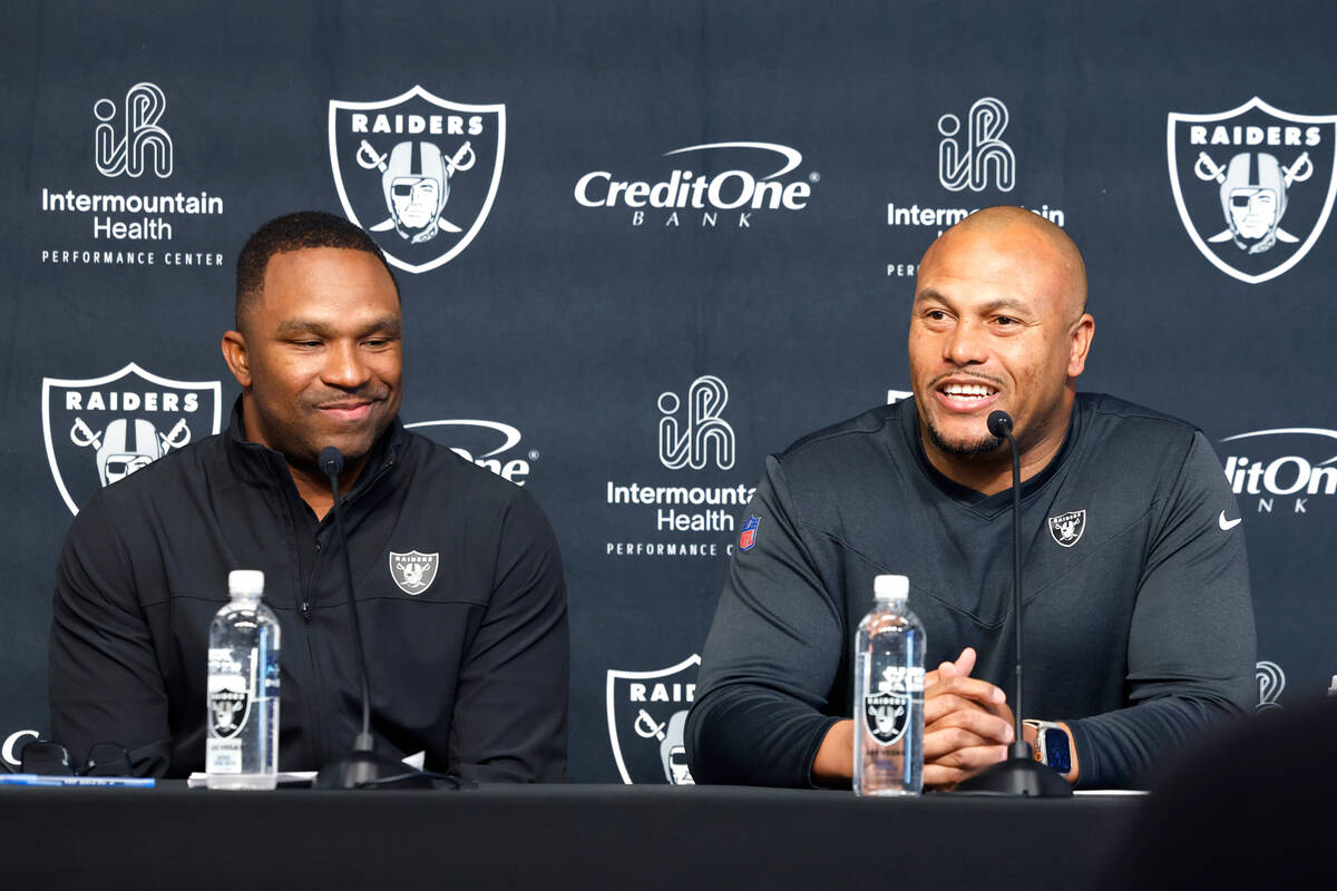 Champ Kelly, Raiders interim general manager, left, and Antonio Pierce, interim head coach, smi ...