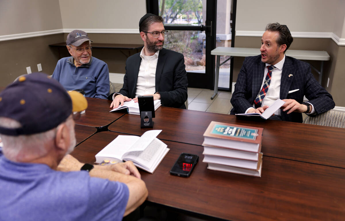 Rabbi Nachum Meth, right, participates in a class led by Rabbi Aryeh Goldman, second from right ...
