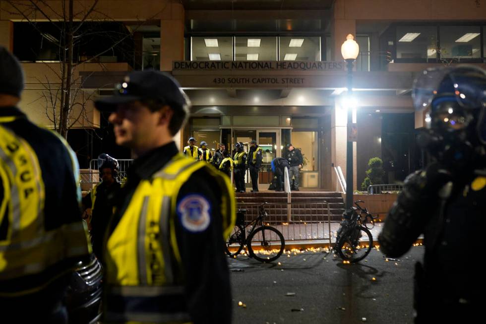 U.S. Capitol Police stand outside the headquarters of the Democratic National Committee Wednesd ...