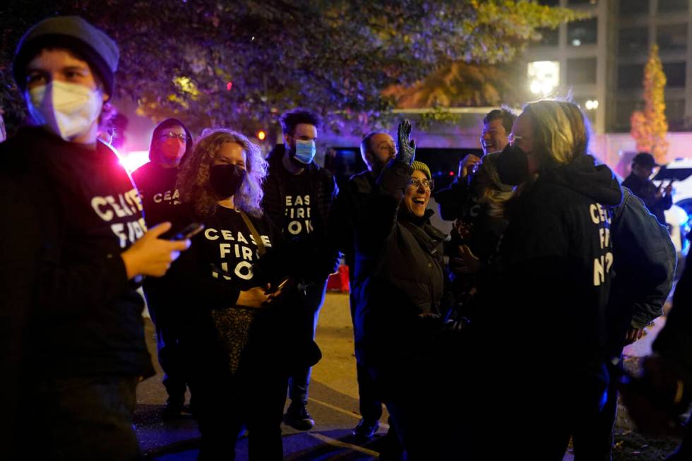 Protesters cheer outside the Democratic National Committee headquarters Wednesday, Nov. 15, 202 ...