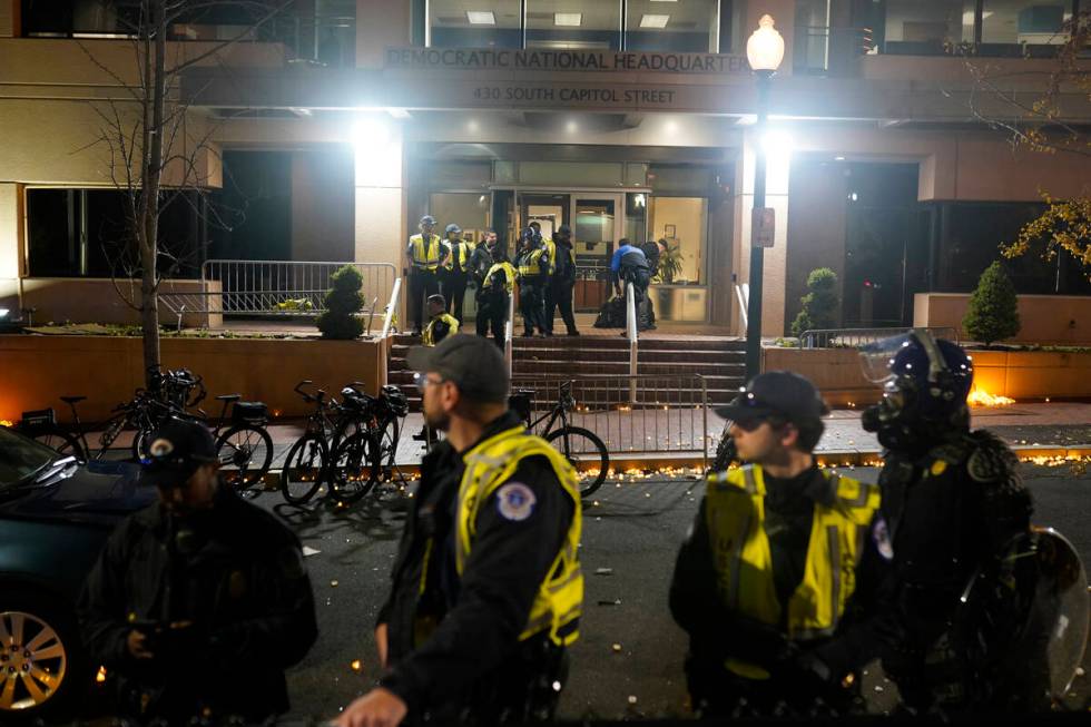 U.S. Capitol Police stand outside the headquarters of the Democratic National Committee Wednesd ...