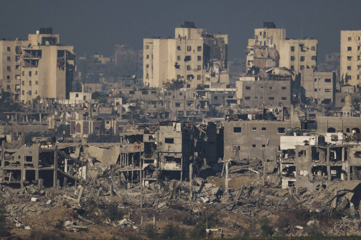 Destroyed buildings stand in the Gaza Strip, as seen from southern Israel, Thursday, Nov. 16, 2 ...