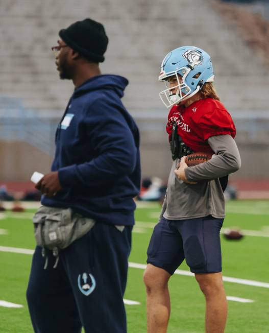 Centennial quarterback Victor Plotnikov runs through a drill during a team practice at Centenni ...