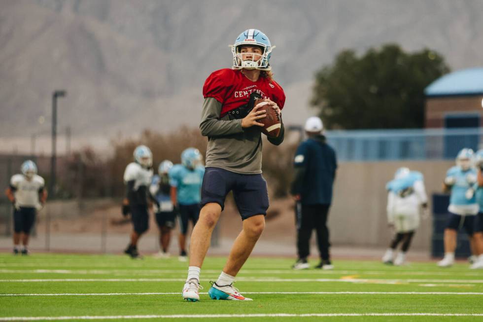 Centennial quarterback Victor Plotnikov runs through a drill during a team practice at Centenni ...