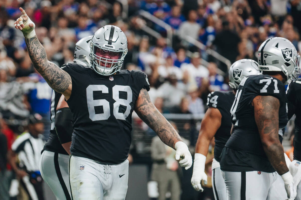 Raiders center Andre James (68) celebrates a Raiders touchdown during the first half of a game ...