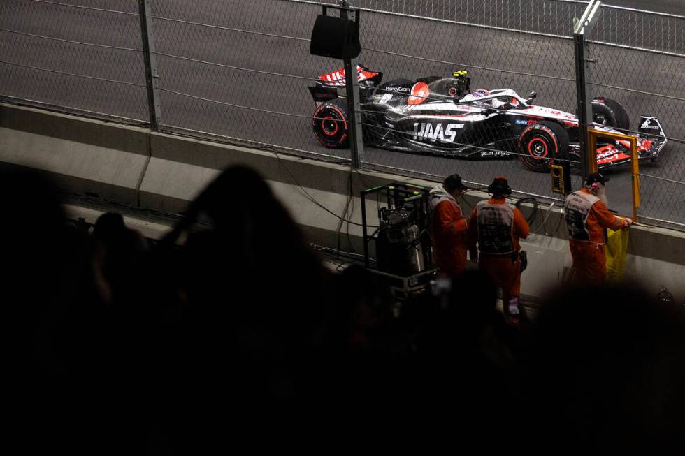 A Haas car rounds the track during the first practice day of the Formula One Las Vegas Grand Pr ...