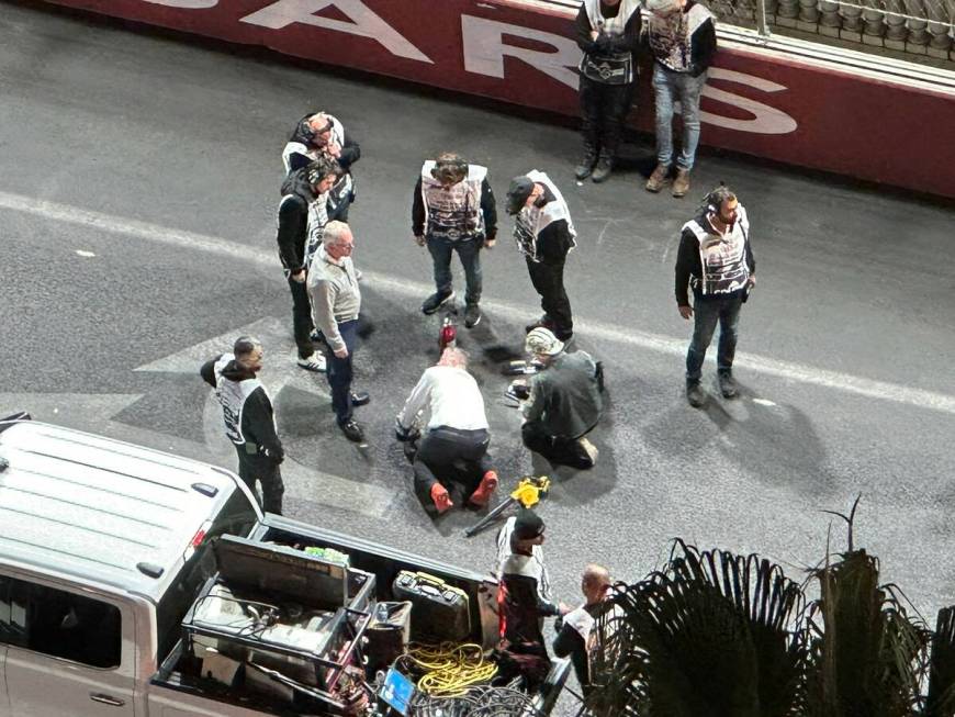 Crews are seen working on the track problem caused by an issue with a drain cover at the first ...