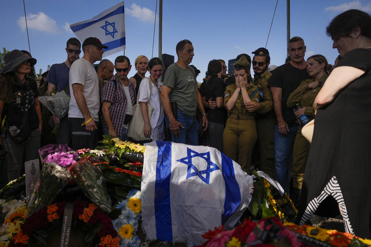 Mourners attend the funeral of Israeli soldier, Noa Marciano, in Modiin, Israel, Friday, Nov. 1 ...