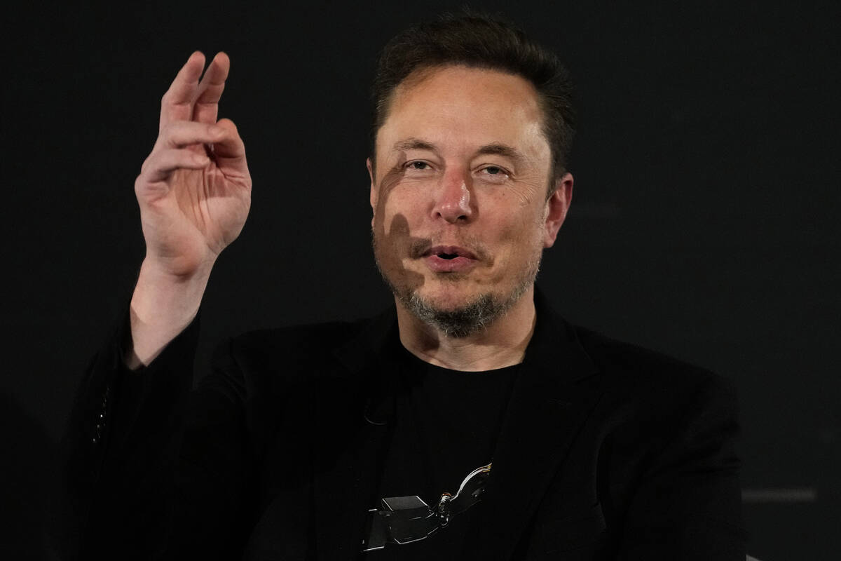 Elon Musk, owner of social media platform X, gestures during an event with Britain's Prime Mini ...