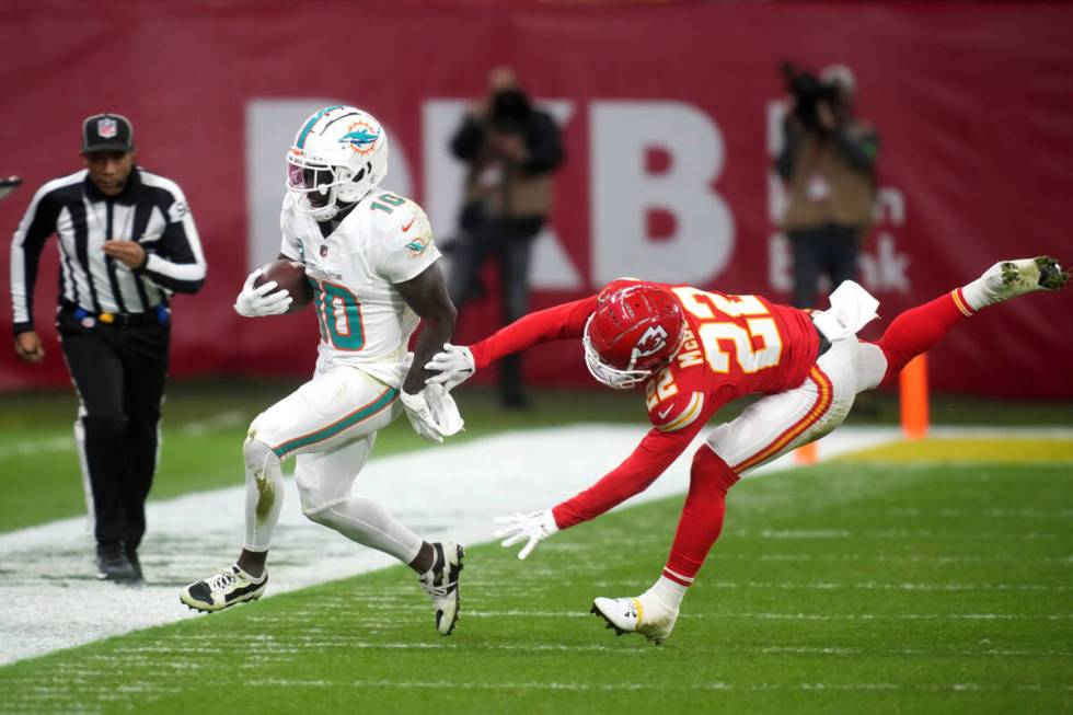 Miami Dolphins wide receiver Tyreek Hill (10) runs out of bounds as Kansas City Chiefs cornerba ...