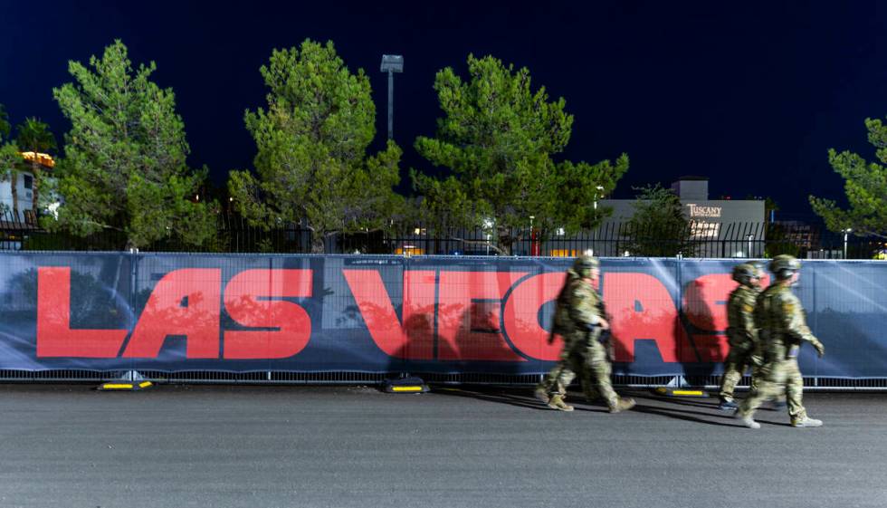 An FBI security detail walks about the pit building during the second night of the Las Vegas Gr ...