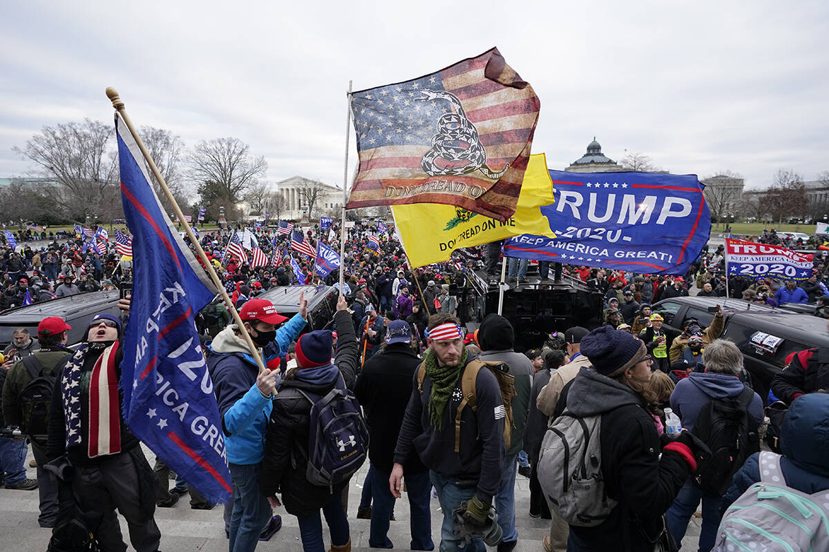 Trump supporters gather outside the Capitol, Wednesday, Jan. 6, 2021, in Washington. As Congres ...