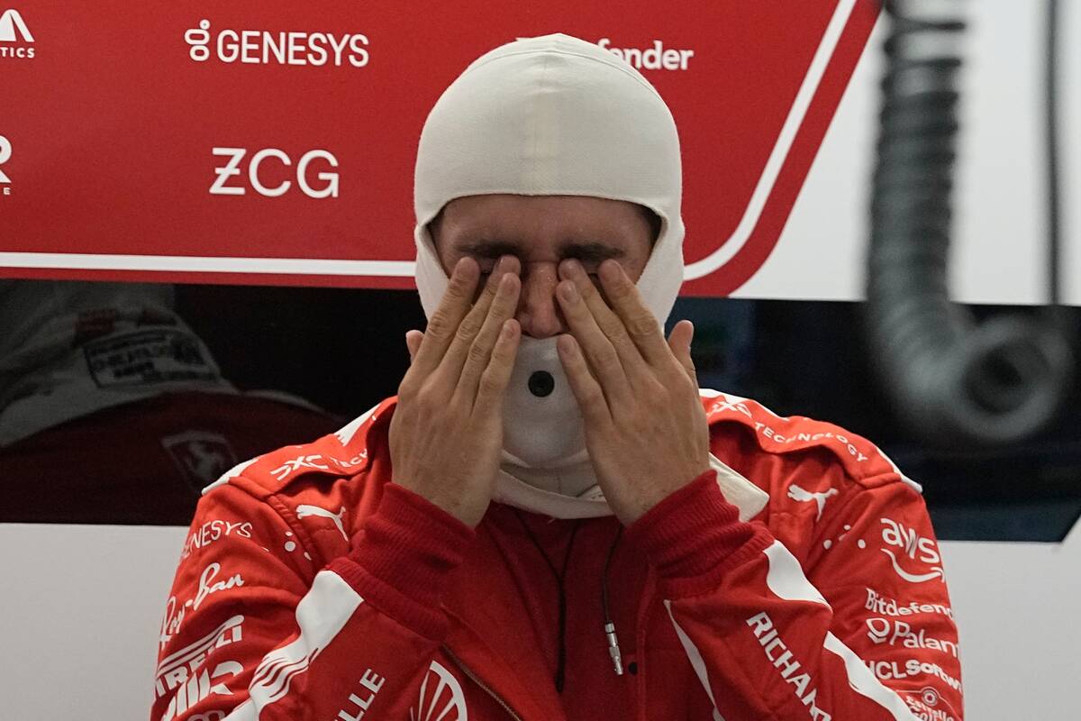 Ferrari driver Charles Leclerc, of Monaco, rubs his eyes before the start of the second practic ...