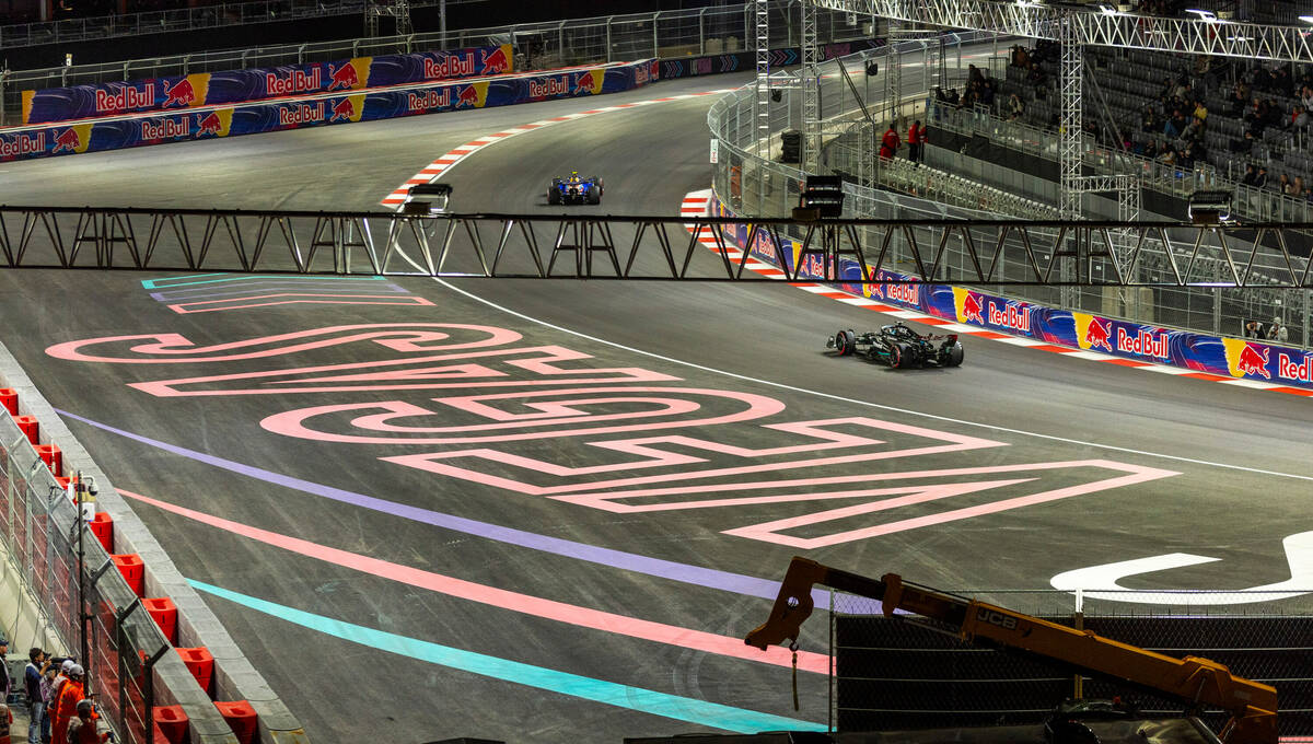 Cars navigate turn 3 during the qualifying session on the second night of the Las Vegas Grand P ...