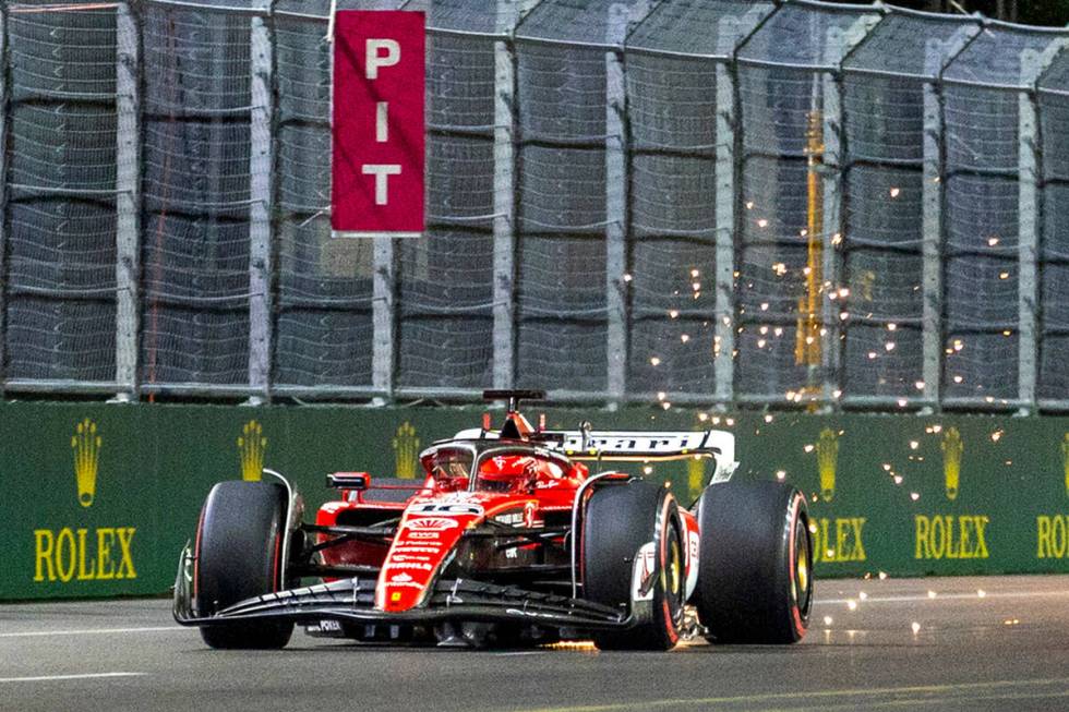 Ferrari driver Charles LeClerc kicks up sparks on the final stretch during the qualifying sessi ...