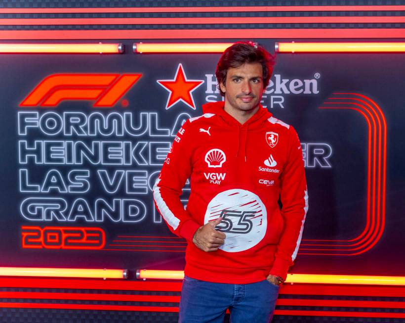 Ferrari driver Carlos Sainz momentarily stops on the "red carpet" during race night o ...