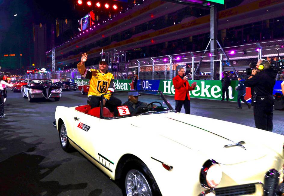 Driver Valtteri Bottas wears a Vegas Golden Knights jersey while riding in the driver’s parad ...