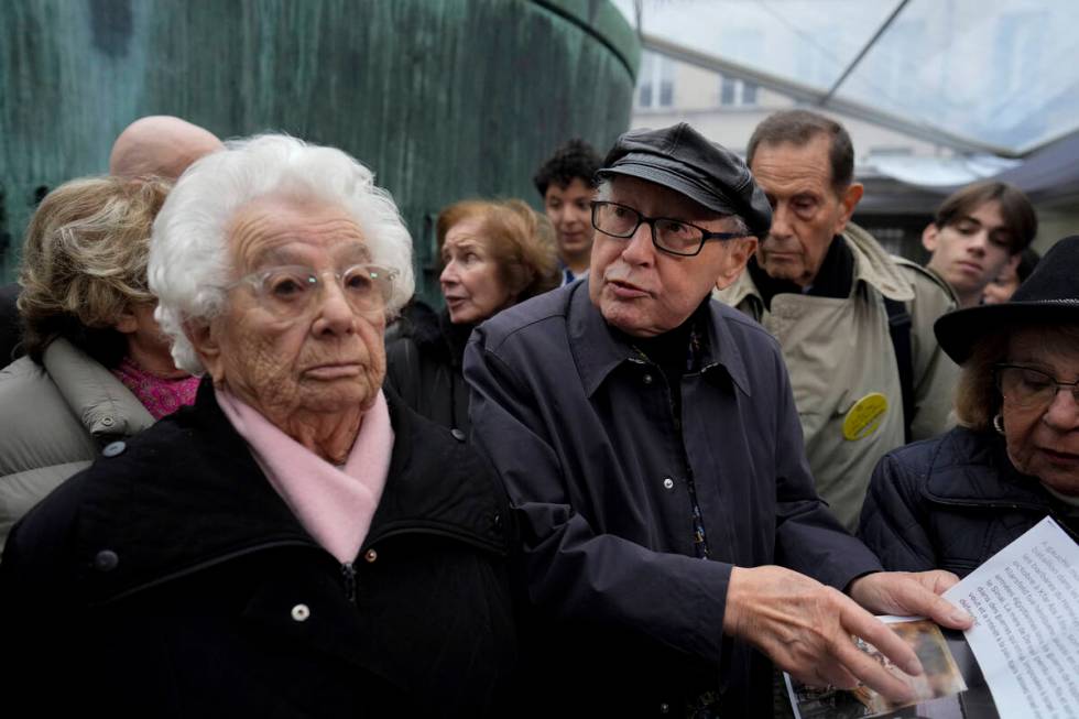 French nazi hunter Serge Klarsfeld, center right, and Auschwitz concentration camp survivor Est ...