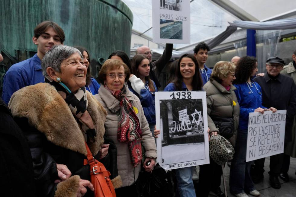 French Holocaust survivor Ginette Kolinka, left, smiles as she attends a gathering in the Paris ...