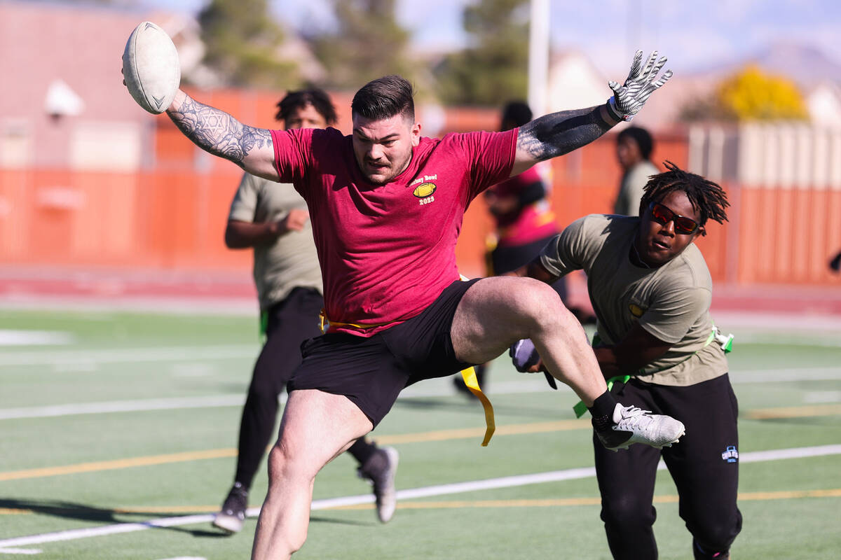 Kaleb Friedman, North Las Vegas K9 officer, dodges Korey Hardison, a Canyon Springs High School ...