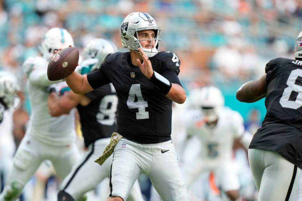 Las Vegas Raiders quarterback Aidan O'Connell (4) aims a pass during the first half of an NFL f ...