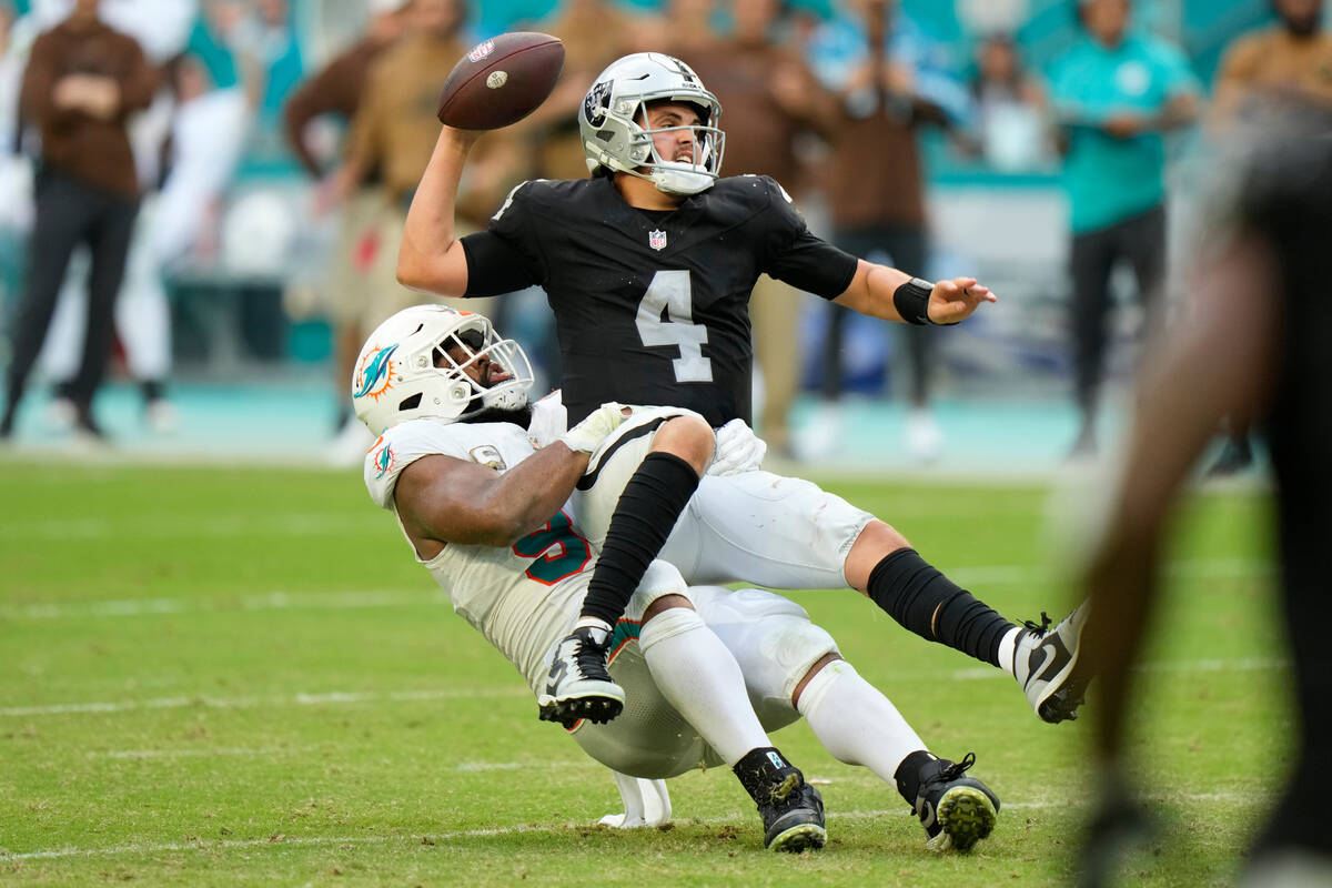 Miami Dolphins defensive tackle Christian Wilkins (94) takes down Las Vegas Raiders quarterback ...