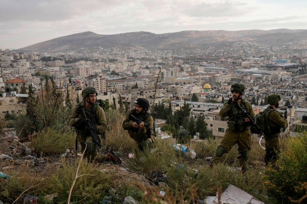 Israeli soldiers are seen during a military operation in the Balata refugee camp, West Bank, Su ...