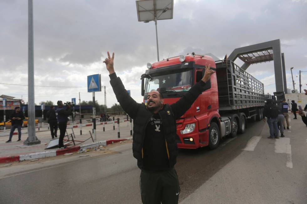 A Jordanian humanitarian aid convoy enters the Gaza Strip from Egypt in Rafah on Monday, Nov. 2 ...