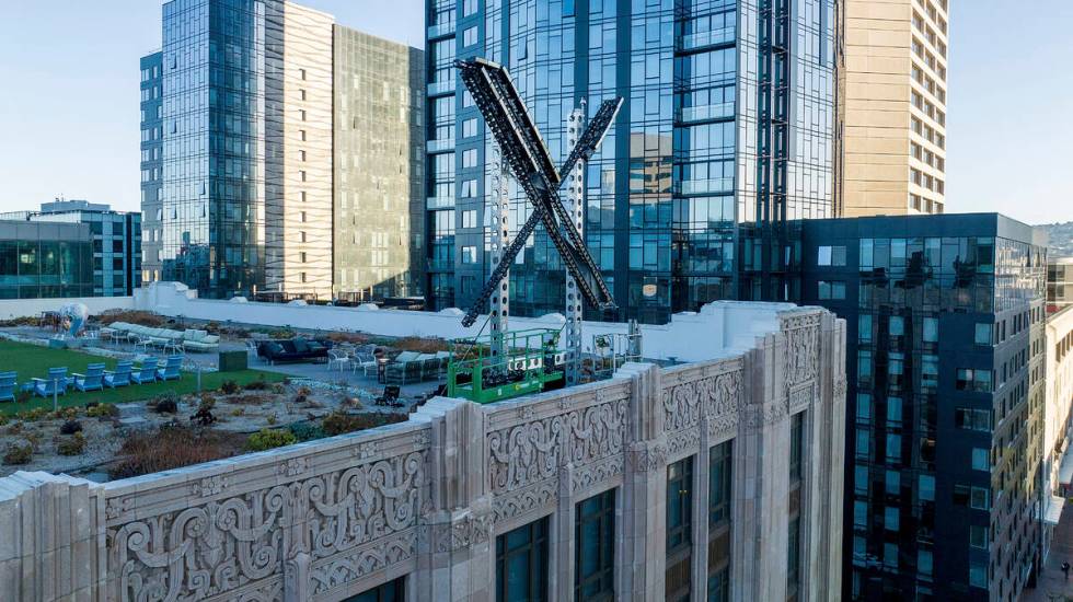 FILE - An "X" sign rests atop the company headquarters in downtown San Francisco, on ...