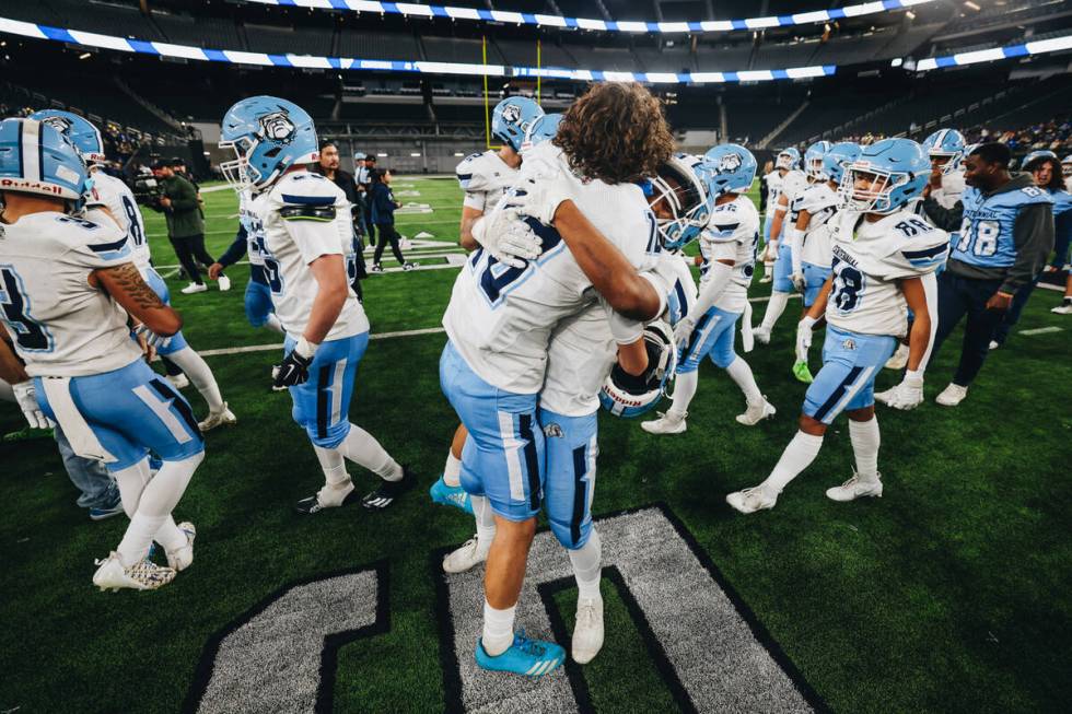 Centennial players celebrate a state championship win over Sunrise Mountain during a class 4A s ...