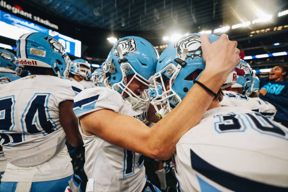 Centennial players celebrate a state championship win over Sunrise Mountain during a class 4A s ...