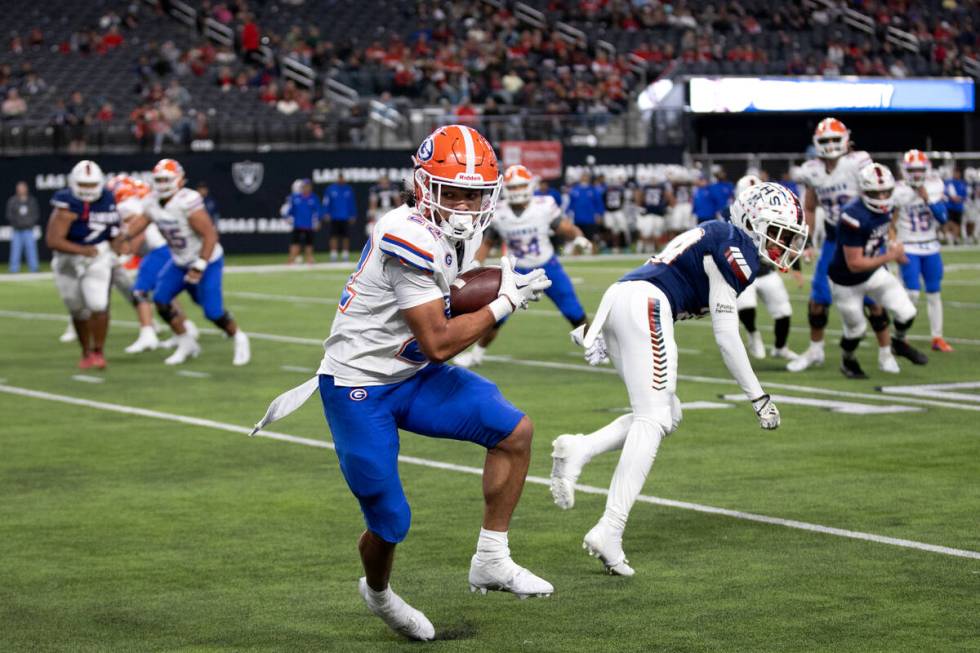 Bishop Gorman’s Keytrin Harris eyes the end zone as he catches the ball before scoring a ...