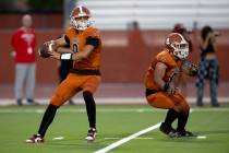 Legacy quarterback Aidan Crawford (9) prepares to throw while running back Phoenix Jennings (8) ...