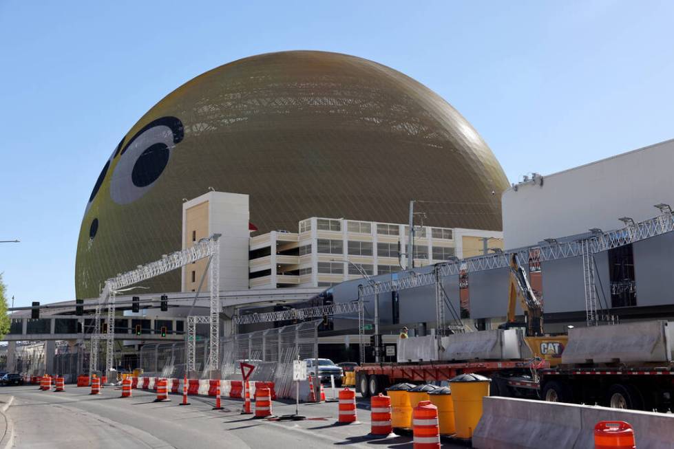 Crews remove barriers from the Formula One Las Vegas Grand Prix race course on Sands Avenue in ...