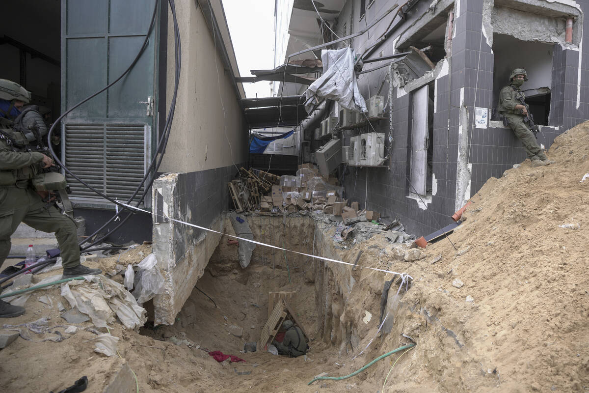 Israeli soldiers show the media an underground tunnel found underneath Shifa Hospital in Gaza C ...