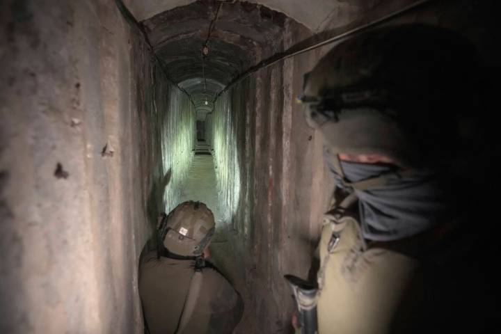 Israeli soldiers show the media an underground tunnel found underneath Shifa Hospital in Gaza C ...