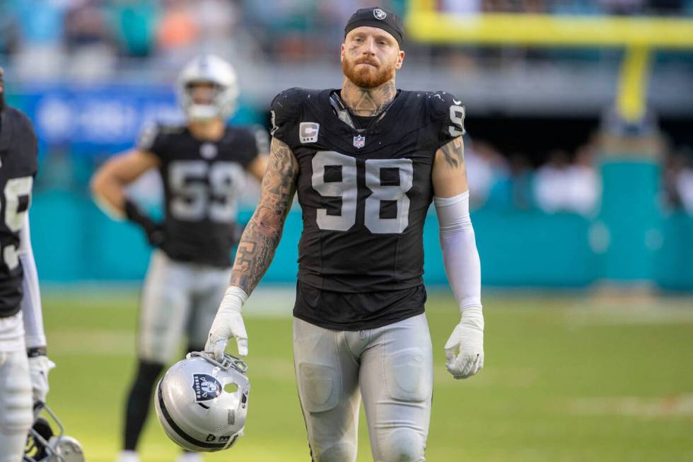 Raiders defensive end Maxx Crosby (98) reacts after Miami Dolphins cornerback Jalen Ramsey (5) ...