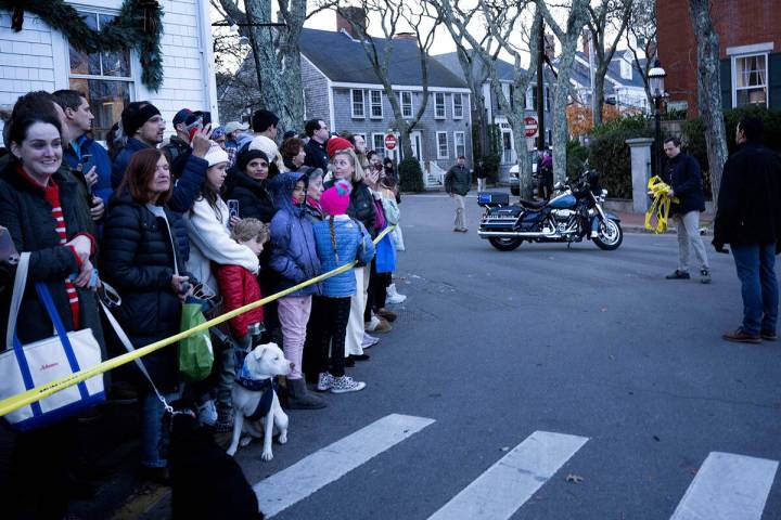 People wait to see U.S. President Joe Biden while he was shopping with family members in downto ...