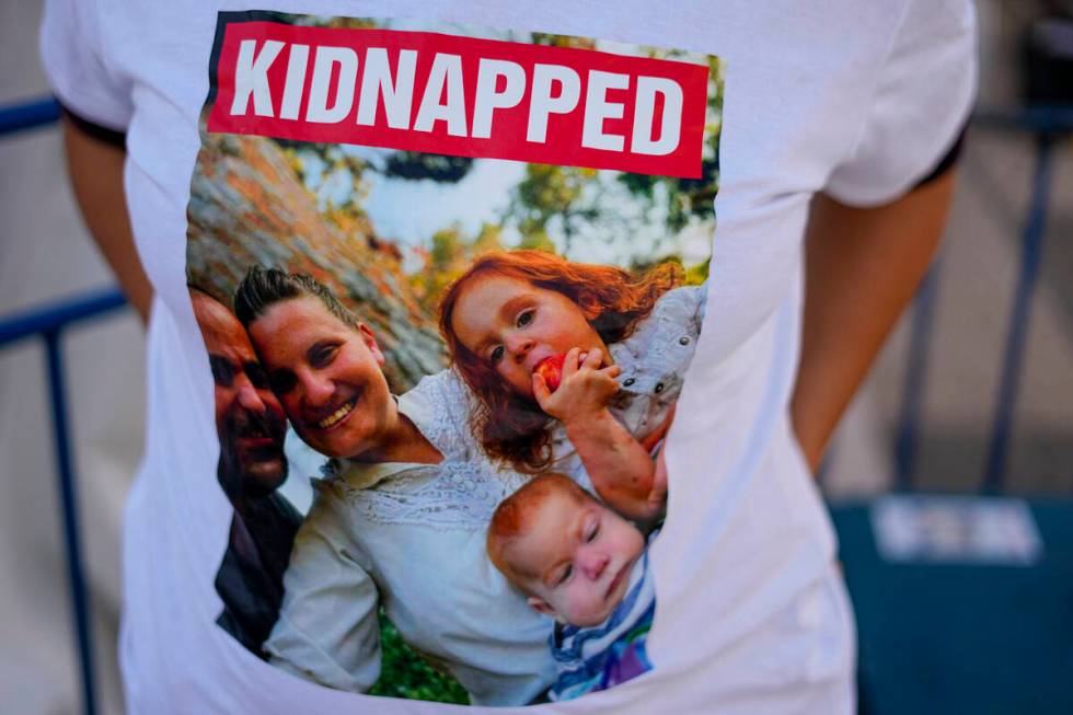 Ofri Bibas Levy wears a shirt with her brother, sister-in-law and their two children, age 4 and ...