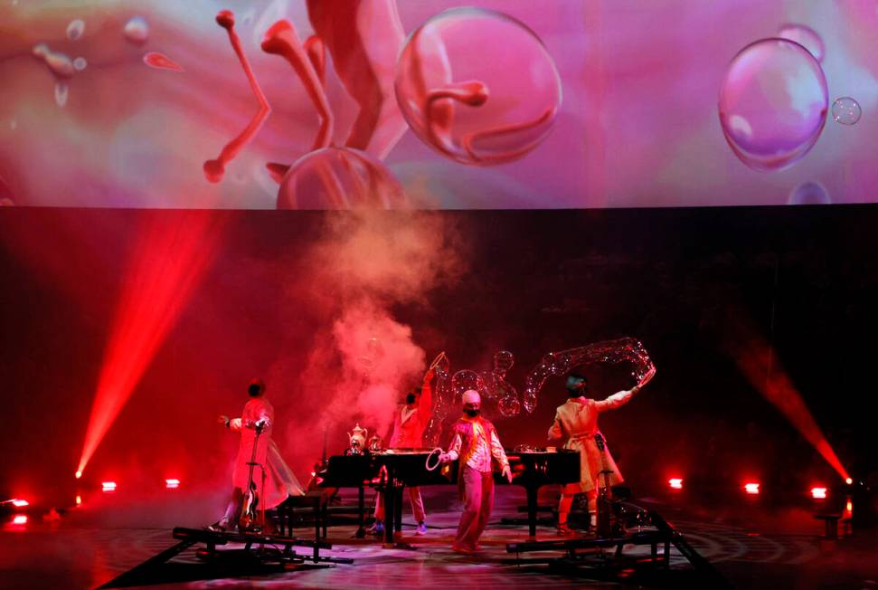 Cast members perform during the grand reopening of "The Beatles LOVE By Cirque du Soleil" at Th ...