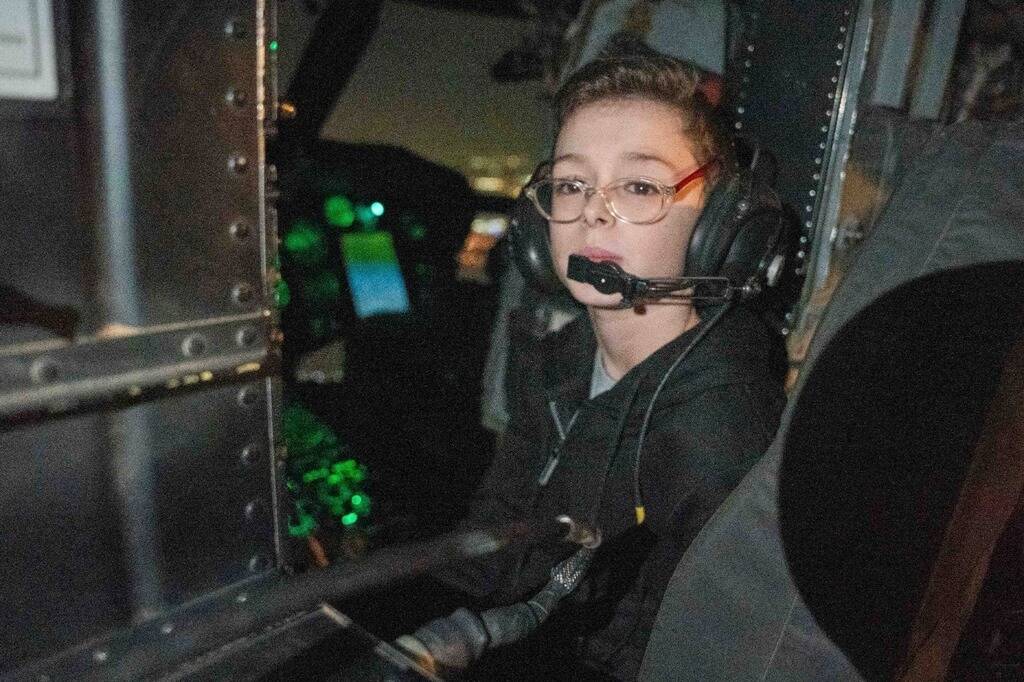 Released Israeli hostage Ohad Munder (9) sits inside an Israeli military helicopter, shortly af ...